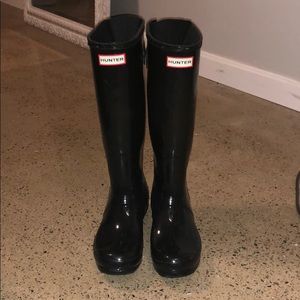 Tall black hunter boots
